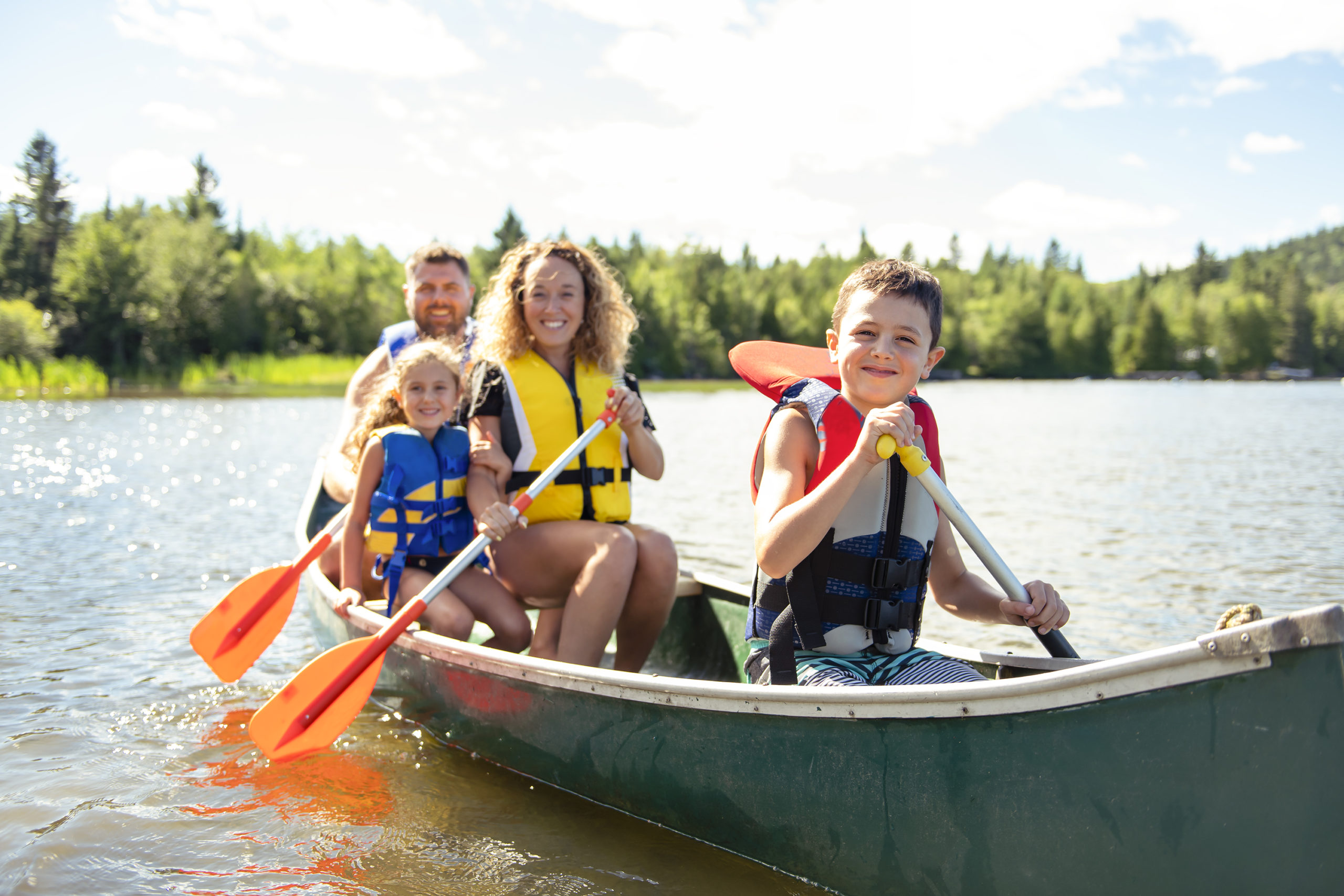 A family riding a canoe